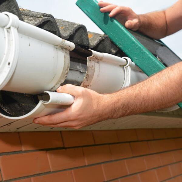 Gutter repairs in Adelaide underway to fix leaks and improve water flow by Roofing Guys Adelaide.