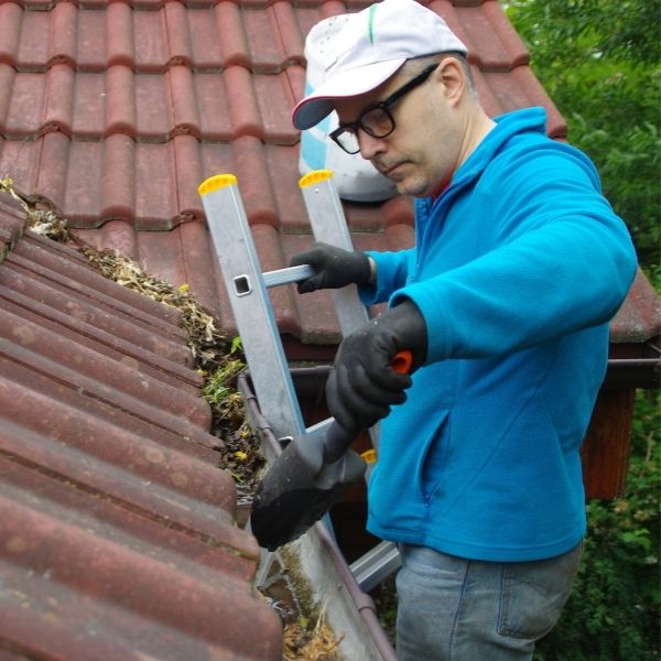Professional gutter cleaning in Adelaide removing debris and blockages by Roofing Guys Adelaide.