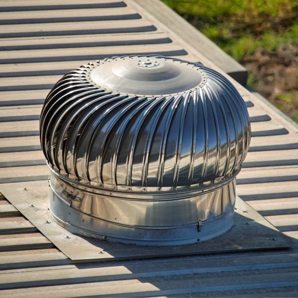 Roof ventilation upgrade underway with a new whirlybird installed by Roofing Guys Adelaide.