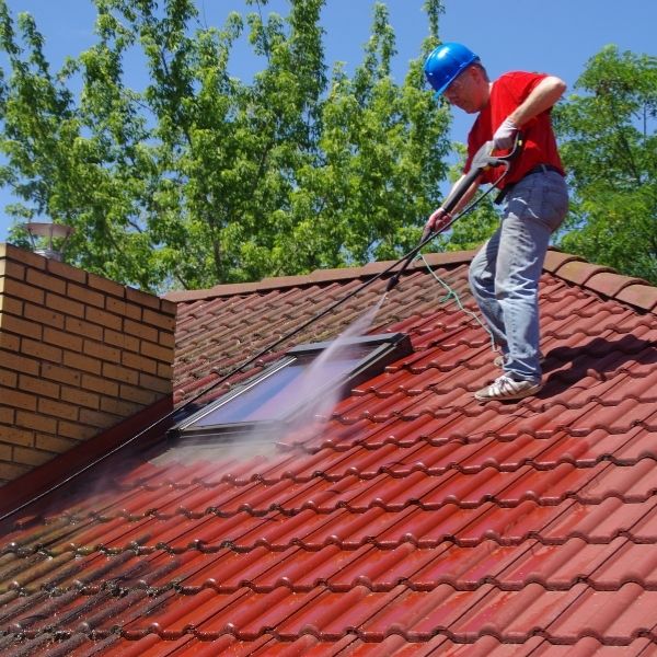 Roofing Guys Adelaide performing professional roof cleaning to improve roof condition and extend its lifespan.